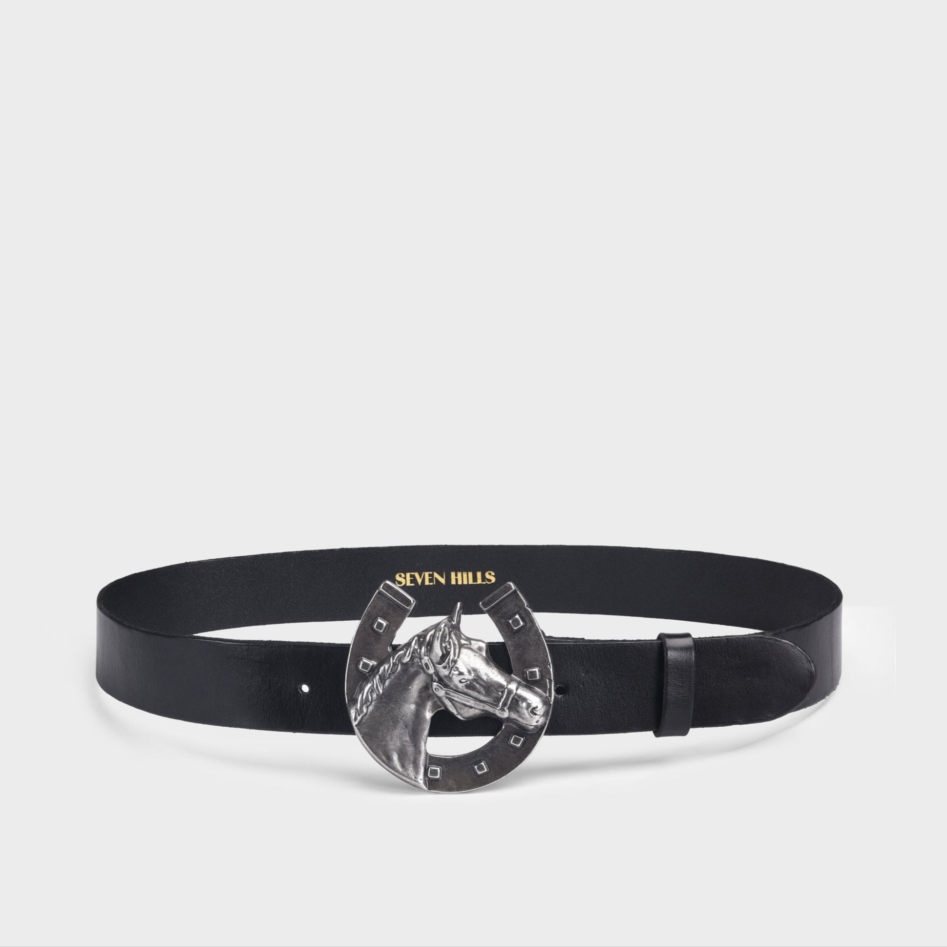 Black belt with a horse shoe buckle on a light gray background