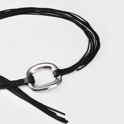 Black leather belt with a silver buckle on a light gray background