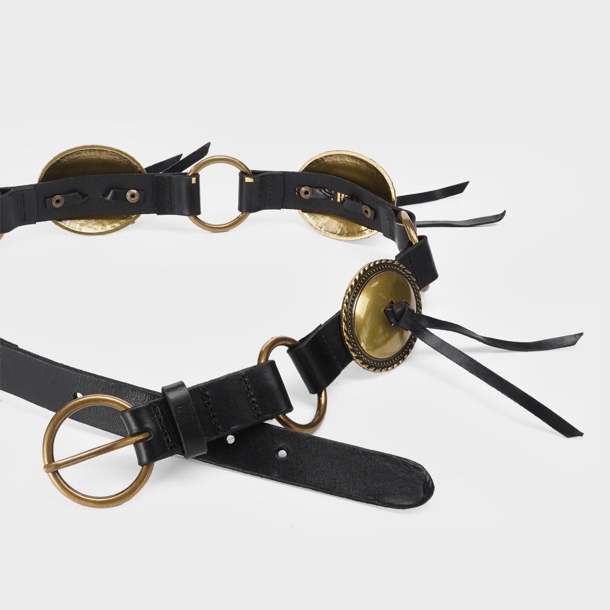 Black leather belt with brass conchos and tassels