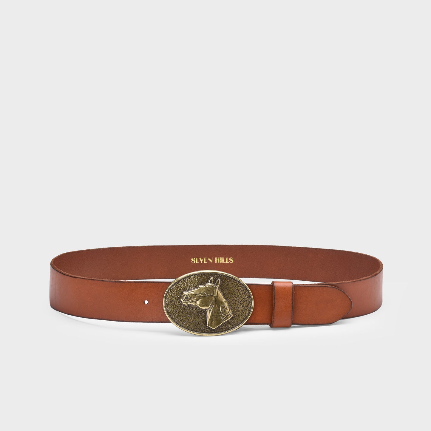 Brown leather belt with a gold buckle on a light gray background