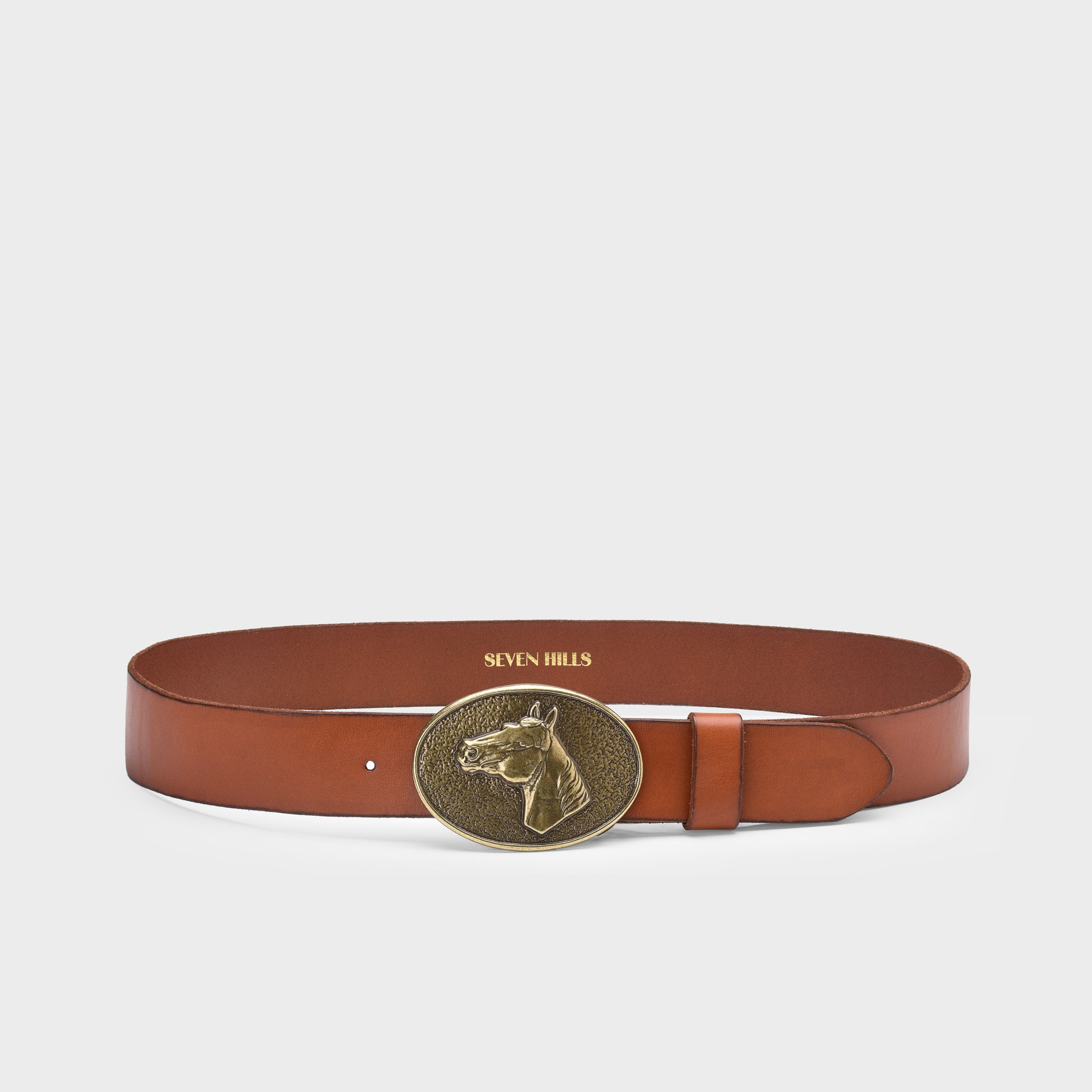 Brown leather belt with a gold buckle on a light gray background
